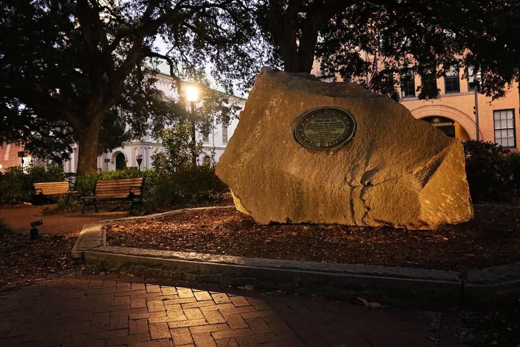Tomochichi's marker in Wright Square in Savannah at night