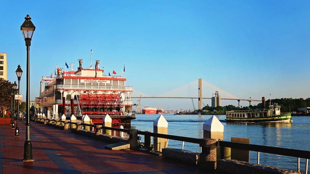 The Georgia Queen riverboat docked on River Street Savannah GA on a bright and sunny day