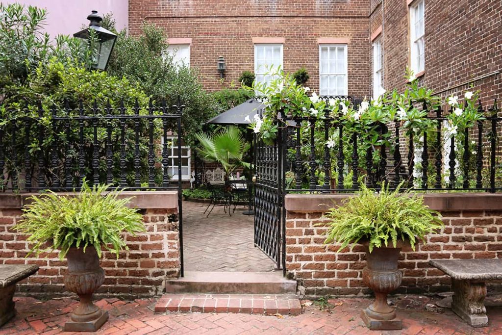 An open gate leading to a private garden on Jones Street