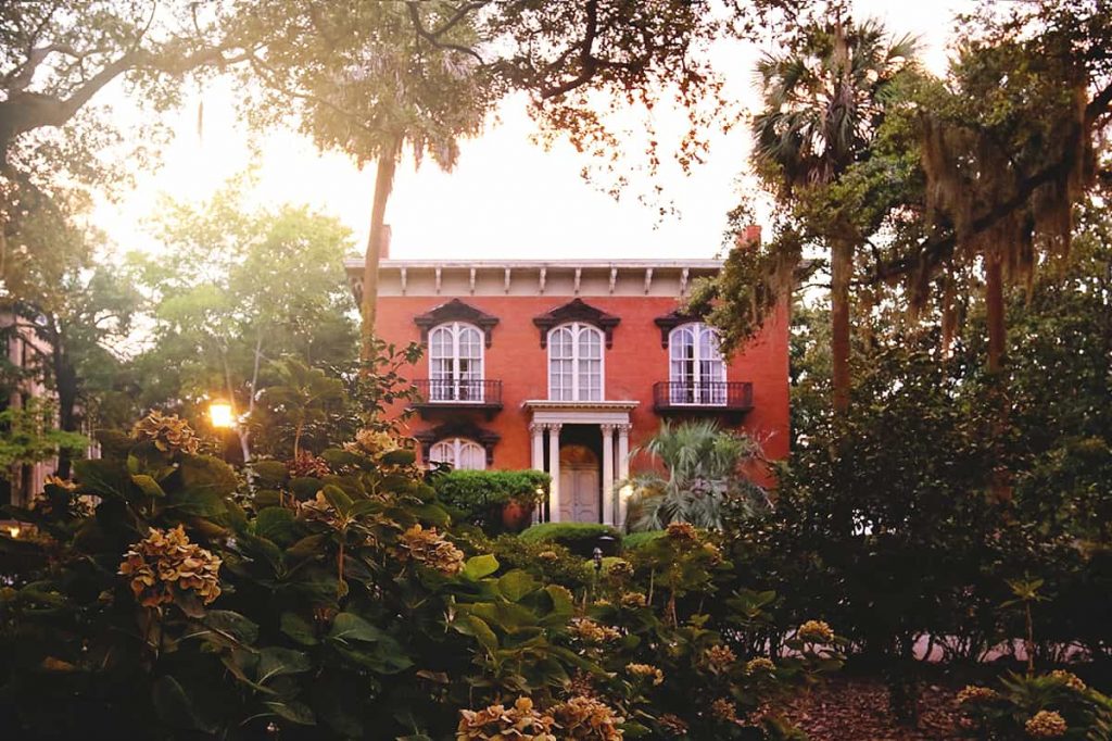 View from Monterey Square looking towards the red brick facade of Mercer-Williams House