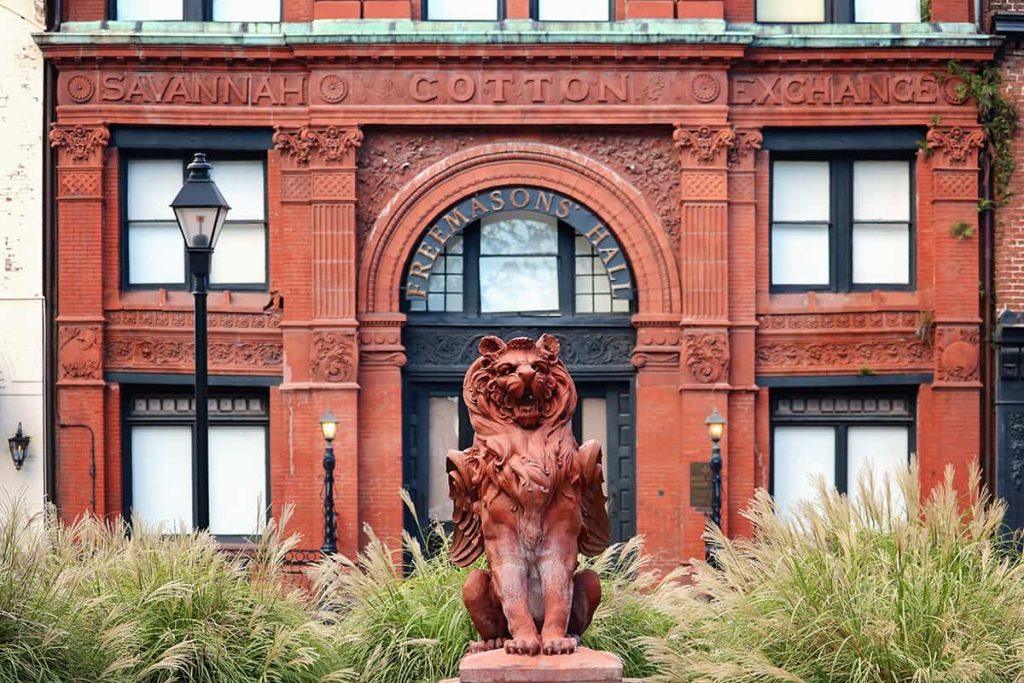 Front facade of the Cotton Exchange Building in Savannah with the winged lion statue standing guard