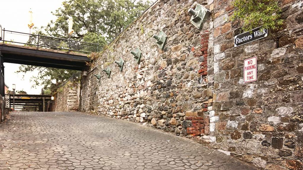 An old wall on Factors Walk constructed from a variety of stones and bricks