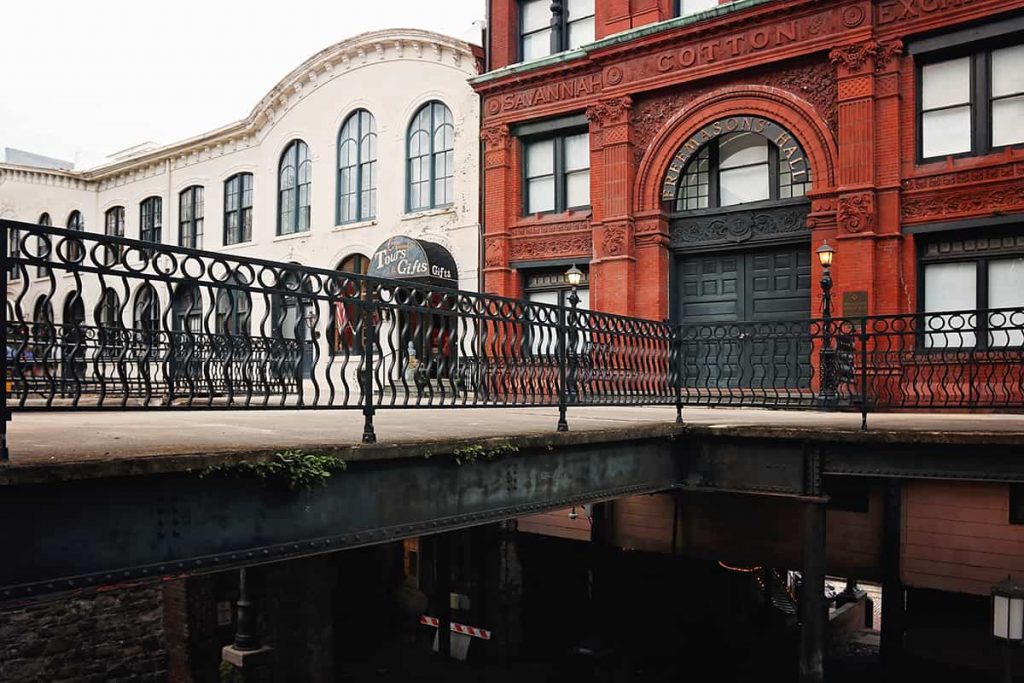 The Savannah Cotton Exchange building with an elaborate terra cotta facade sits atop a concrete and steel framed bridge that's open underneath