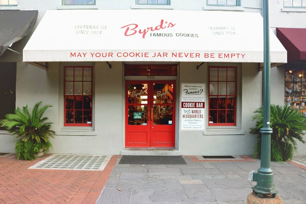 Storefront with cheery red doors and an awning with the Byrd's famous cookies logo