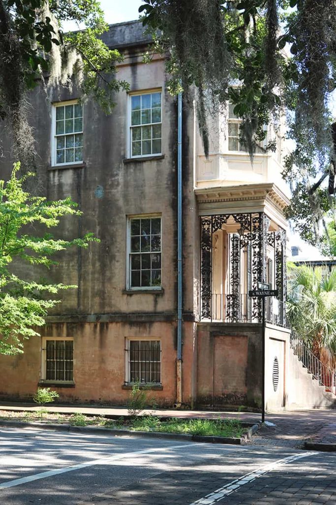 Side view of the 3-story house at 432 Abercorn Street showing signs of age