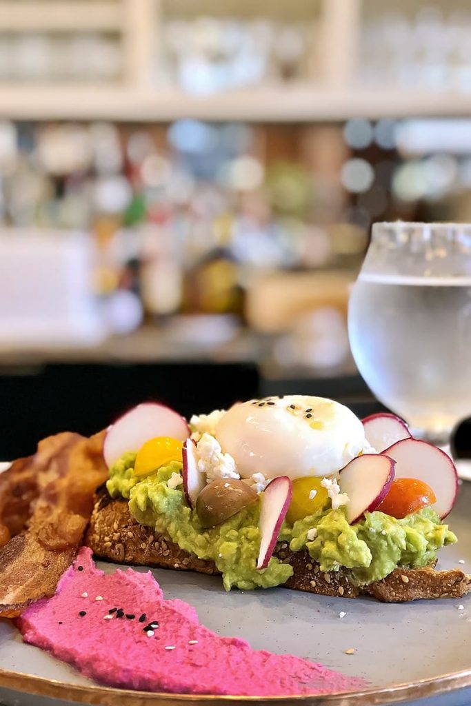 The avocado smash might be the best breakfast in Savannah, with bacon, beet spread, and toast covered in avocado, eggs, beets, and tomato