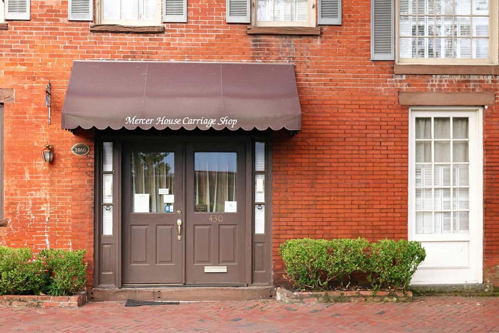 Facade of an unfinished two-story house with no red brick windows