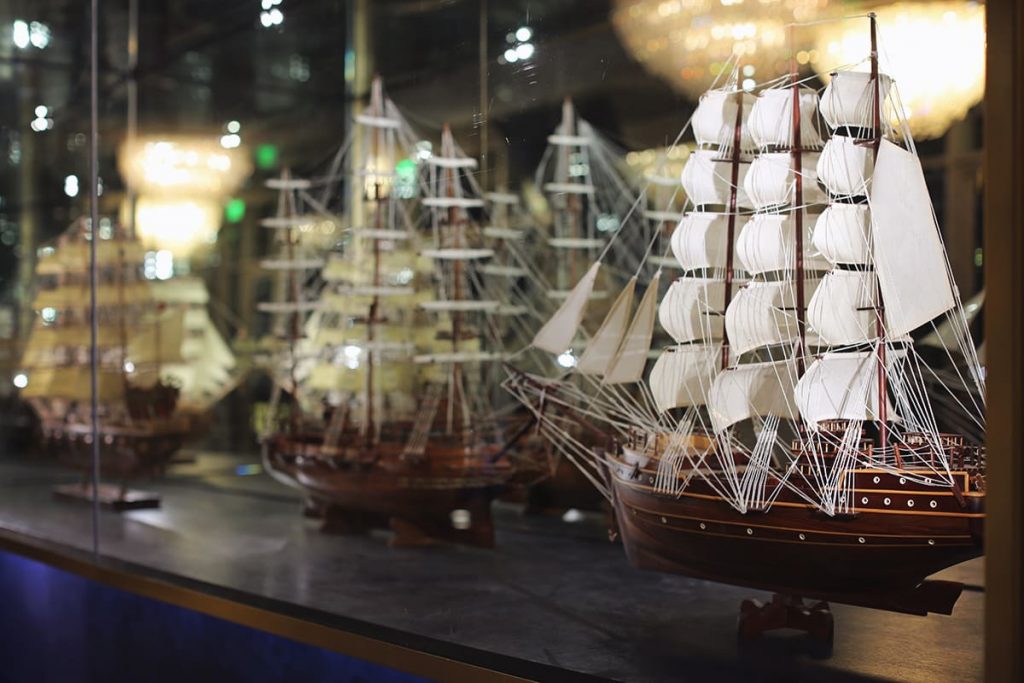 Display case full of intricate model sailboats