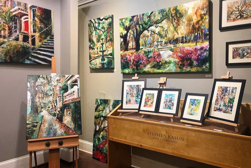 Studio filled with colorful framed art and canvas prints in Savannah's City Market