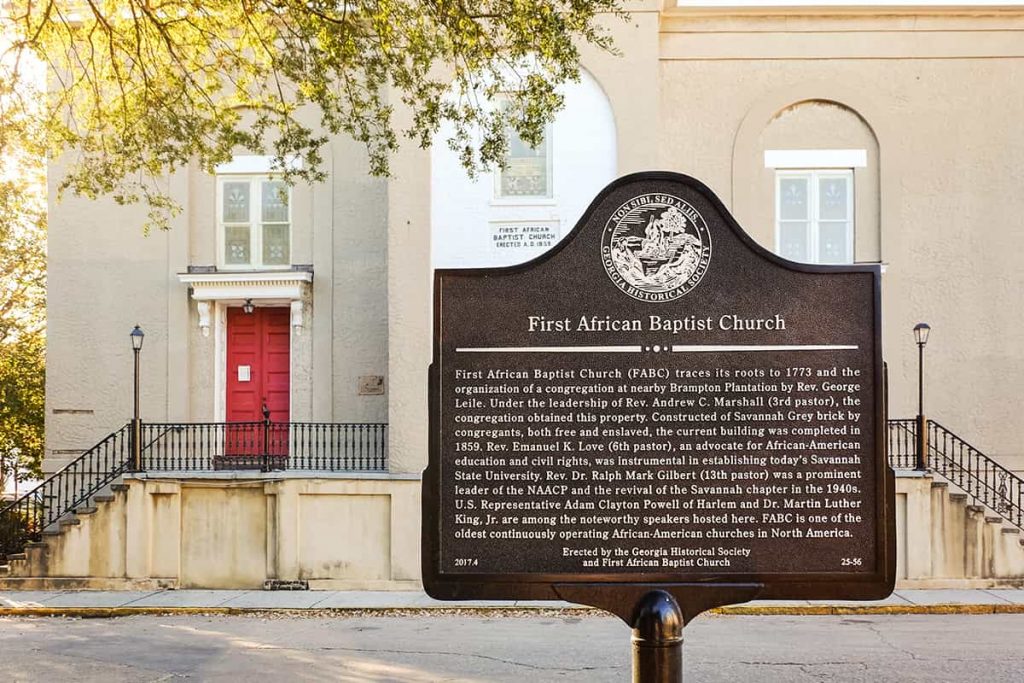 Historic Marker for First African Baptist Church with the church's red front door showing in the background