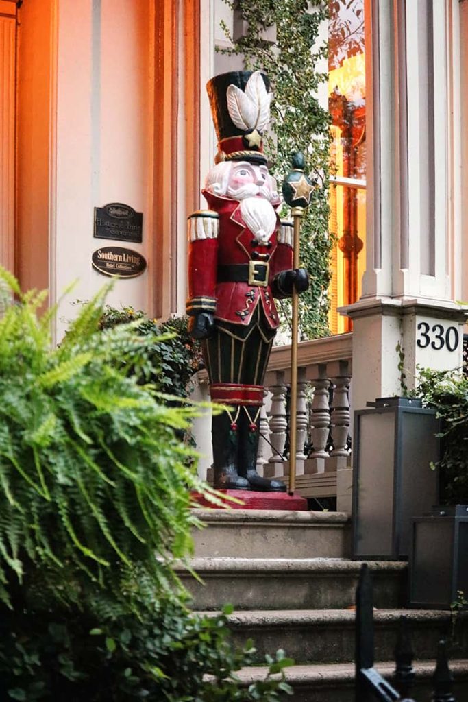 A life-sized nutcracker guarding the door of the Hamilton-Turner Inn during Christmas in Savannah
