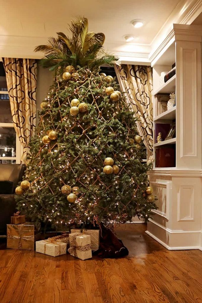 A Christmas tree at The Marshall House in Savannah decorated to look like a pineapple and trimmed in gold