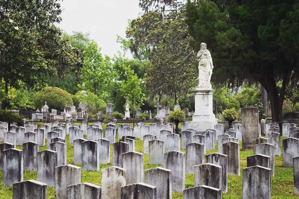 The Silence marker, an adult female carved in stone with one finger to her lips, stands watch over hundreds of Confederate graves in Laurel Grove Cemetery