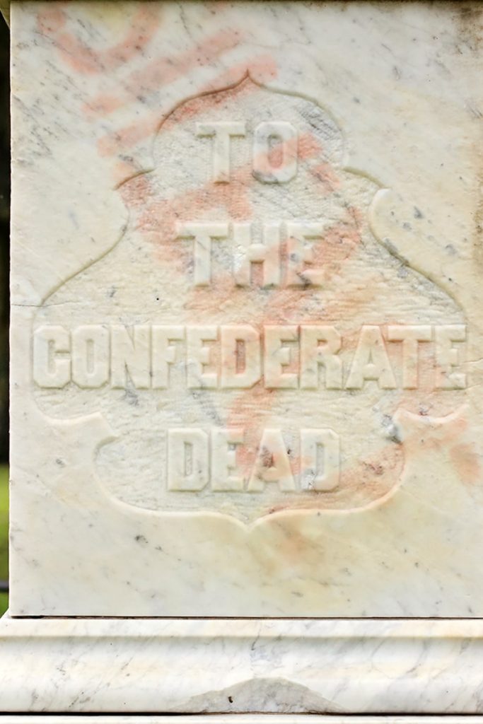 The memorial to the Confederate dead in Laurel Grove North still shows a faint trace of the word "silence" spray painted in red across its surface