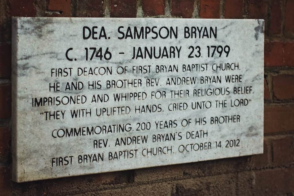 The marker for Sampson Bryan, first deacon of First Bryan Baptist Church in Savannah, who died in 1799. The etching indicates he was imprisoned and whipped for his religious beliefs and "with uplifted hands, cried unto the Lord"