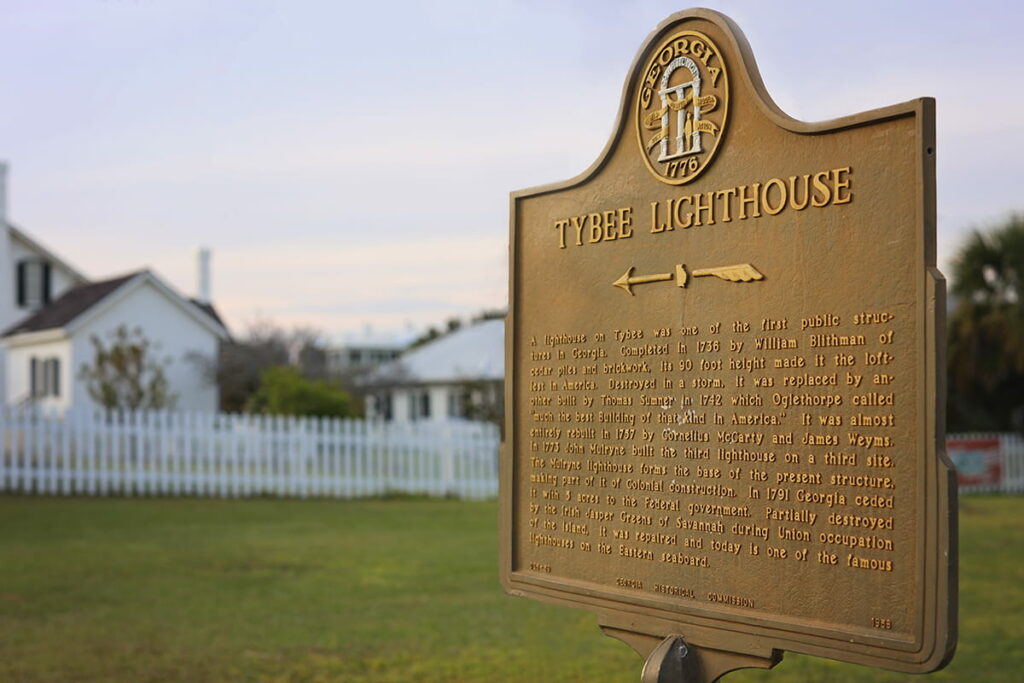 Rust-colored historic marker for the Tybee Island Lighthouse, located on the Georgia coast