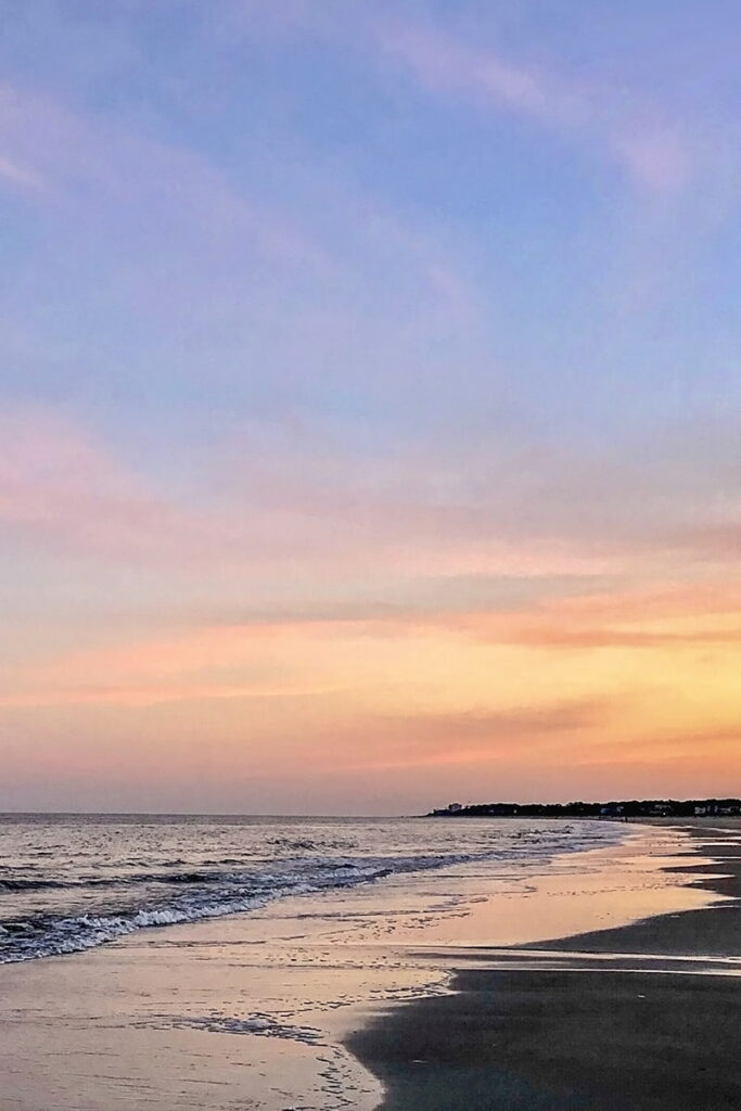 Peaceful sunset in pale pink, yellow, and blue hues on Hilton Head Island