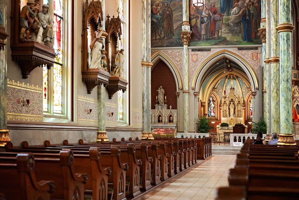 The Stations of the Cross depicting the Passion of Christ line the walls of the Cathedral Basilica of St. John the Baptist in Savannah