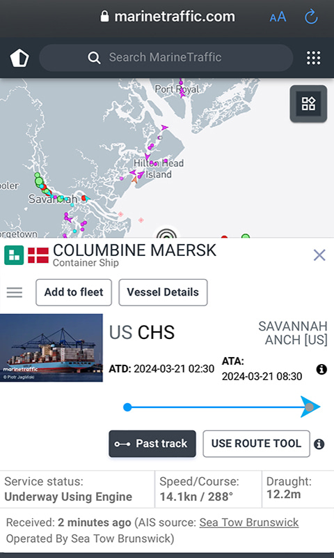 Screenshot of the Marine Traffic app showing vessel details for the Columbine Maersk. It includes an image of the cargo ship, speed, draught, the port of departure (Charleston) and the port of arrival (Savannah